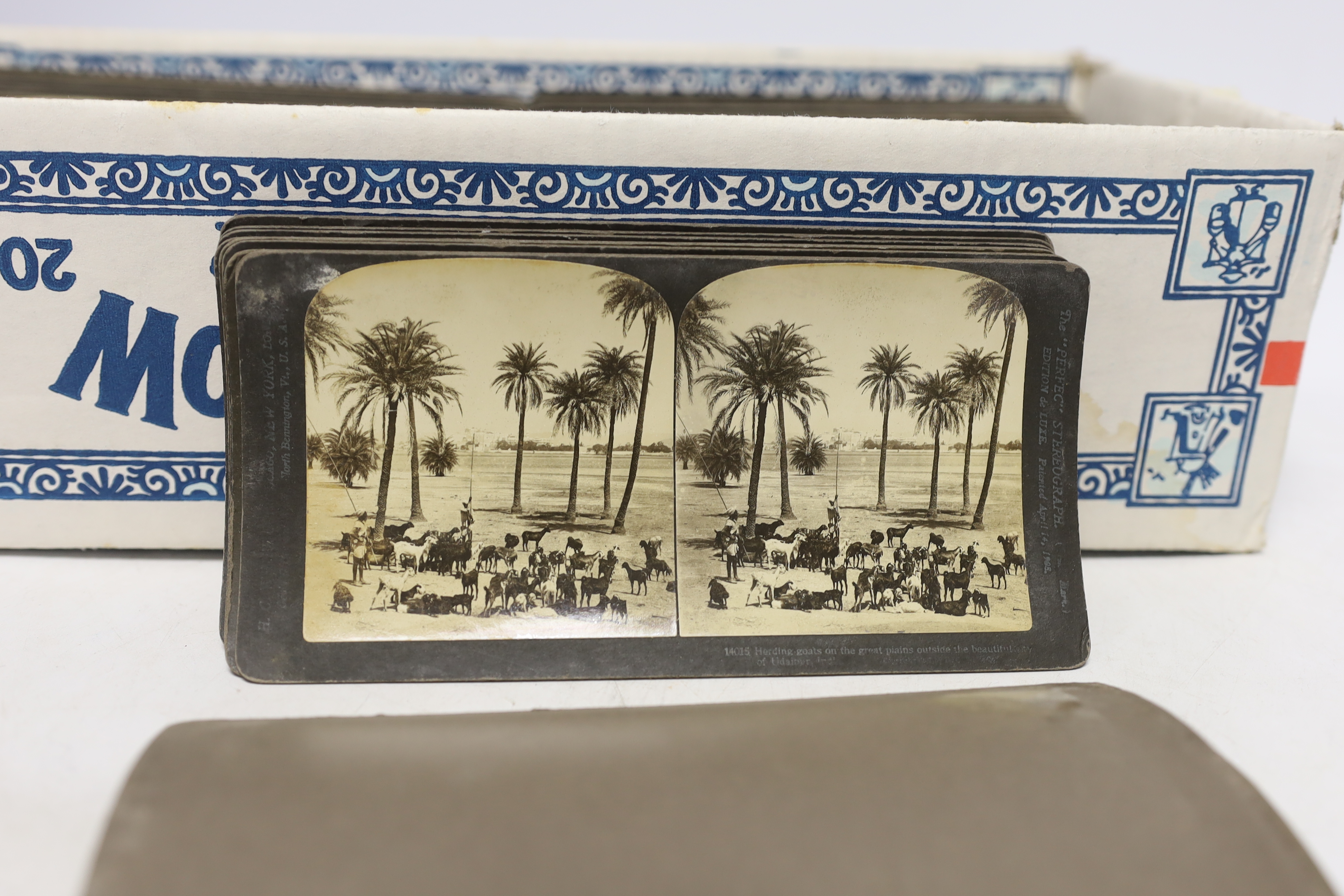 A Stereoscope viewer and slides, mostly topographical including Middle Eastern scenes